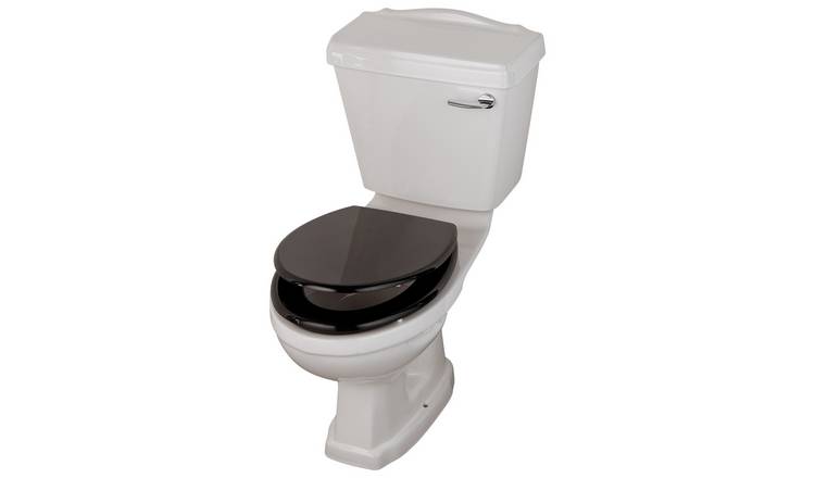 Black toilet seat shop on white toilet