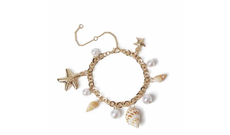 Freedom Gold Tone Pearl Shell and Metal Charm Bracelet