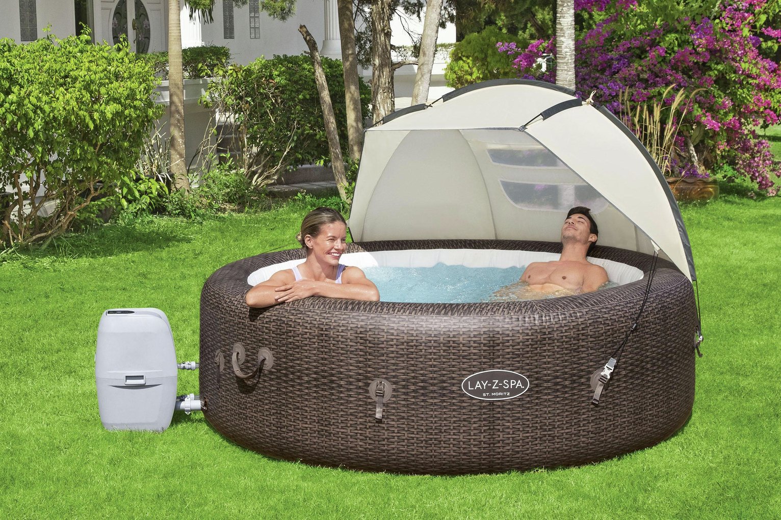 A couple relaxing in a hot tub with Lay-Z-Spa Detachable Hot Tub Canopy over it. 
