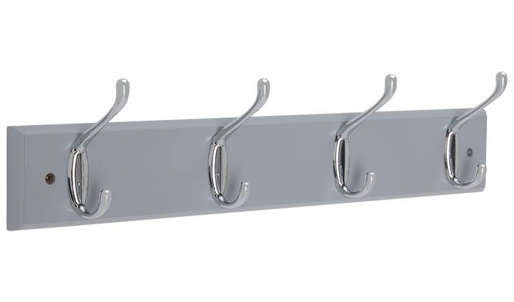 Coat rack made of stainless steel with four hooks on a back plate