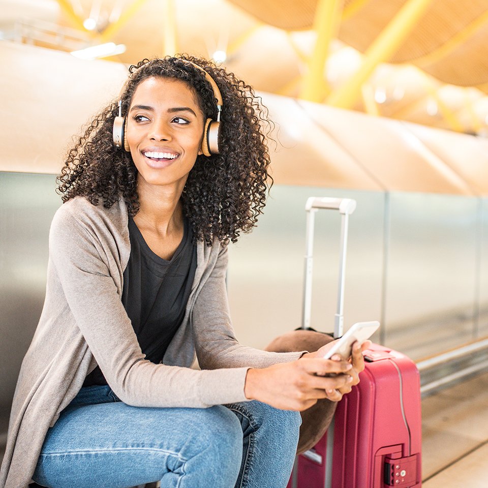 woman at airport with devices