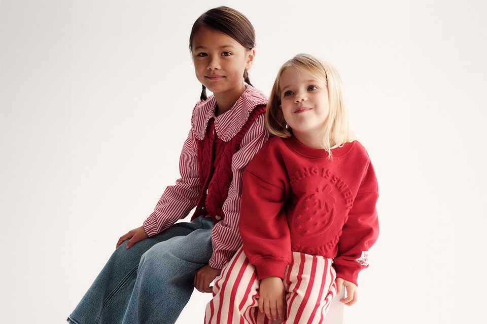 Kids' in ref and pink striped outfits.