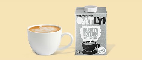 Cup of coffee with oatly barista edition oat drink