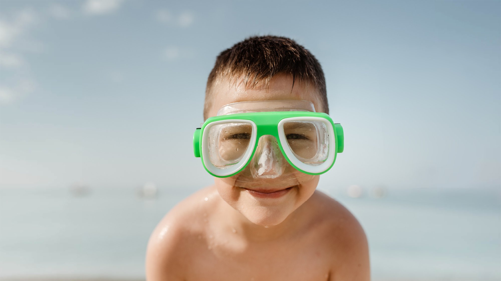 Child with swim goggles