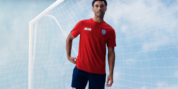 Man wearing red official FA England graphic T-shirt.