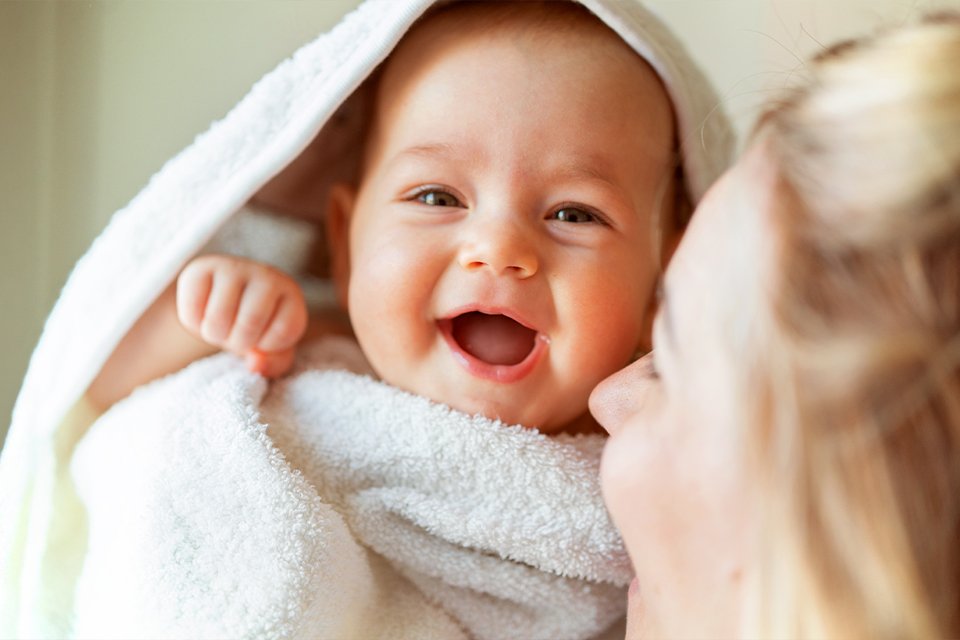 baby held by mother