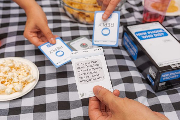 A family playing a card game at a table.