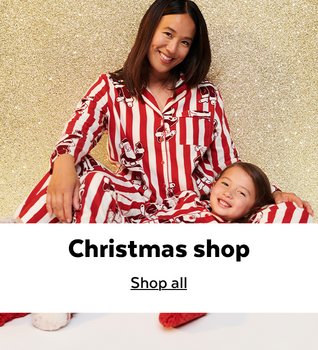 Woman and child in matching Christmas pyjamas