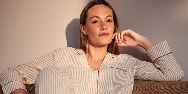 Women in striped pink pyjama set