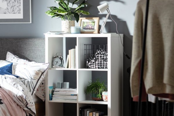 A storage shelf shaped like a house.