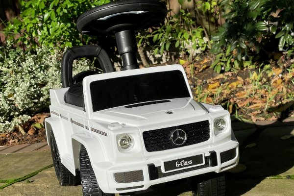A ride-on Mercedes car.