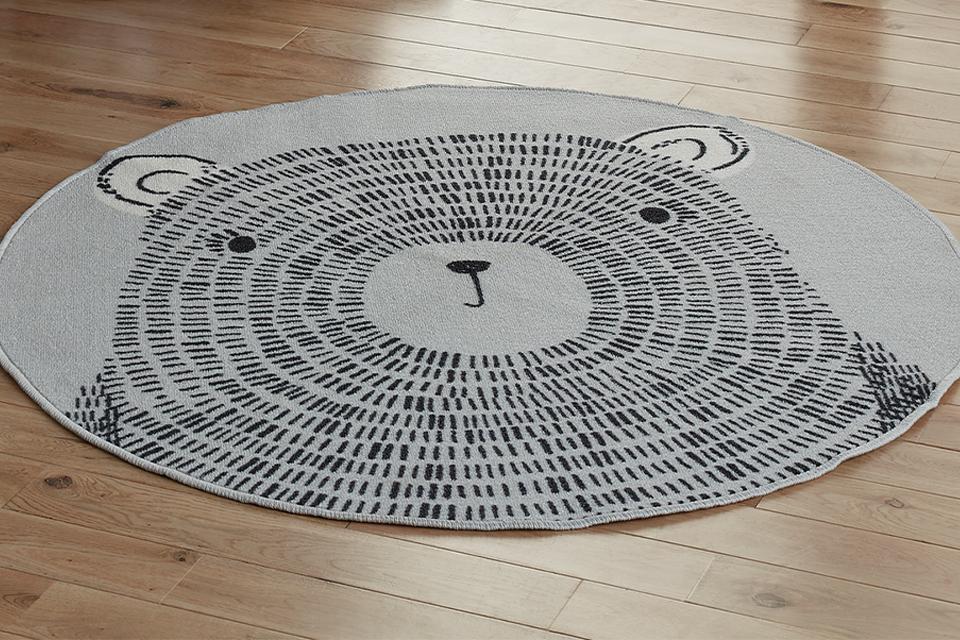 The Argos Home teddy circle rug in a room with other teddy themed accessories.