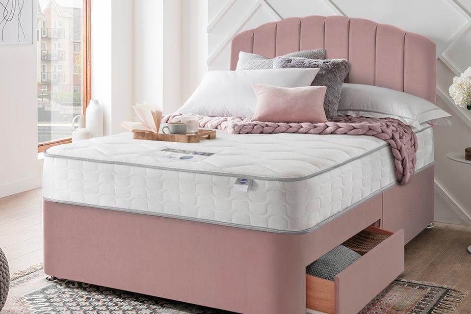 Silentnight dusky pink bed with side storage and a strylish headboard.