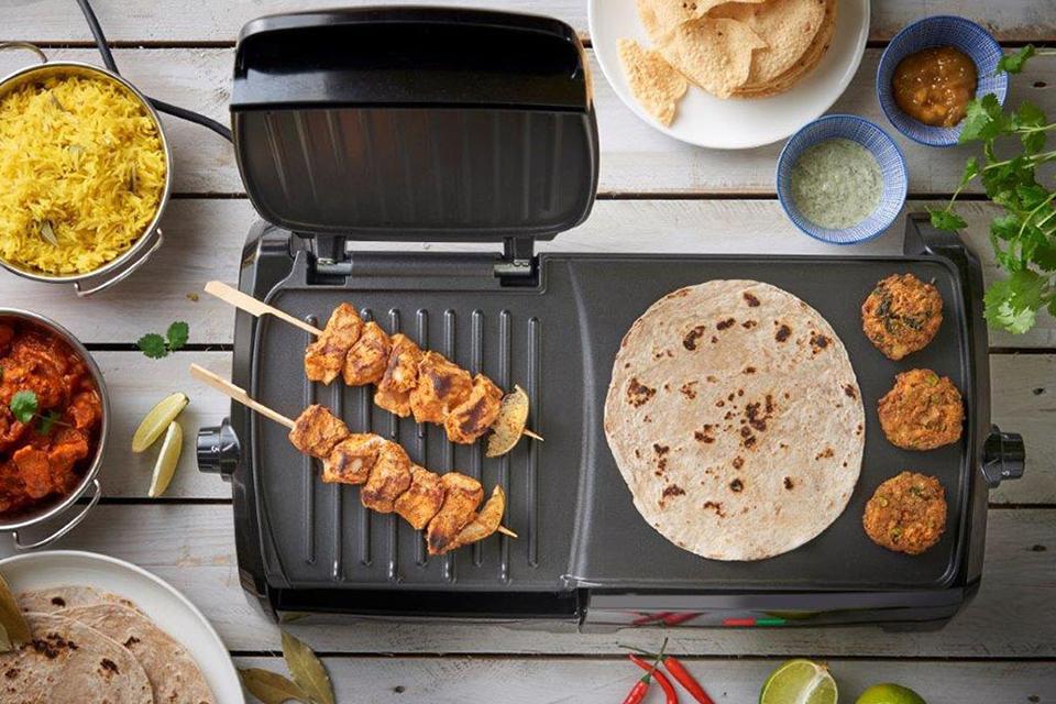 Chicken kebabs, falafel and a flatbread cook on a George Foreman grill.