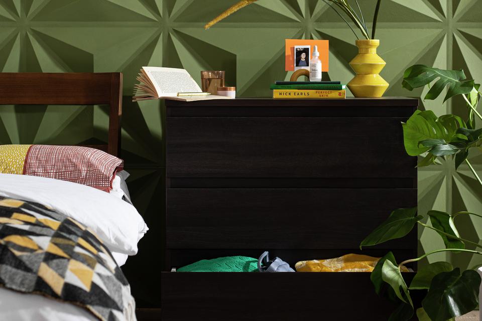 A Habitat 3 drawer chest beside a bed in a bedroom.