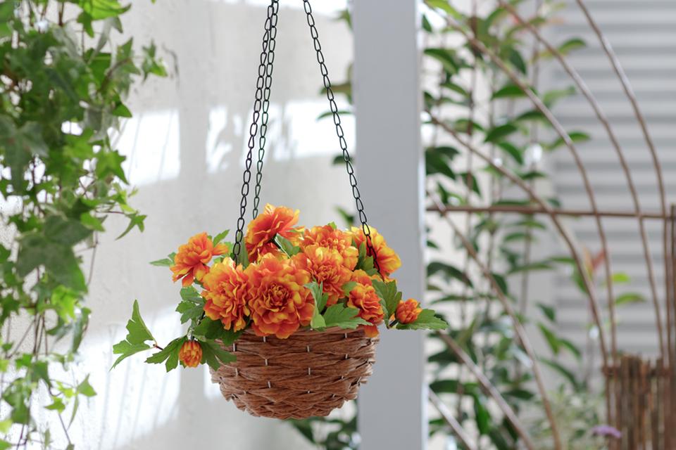 A faux marigold hanging basket in a balcony. 