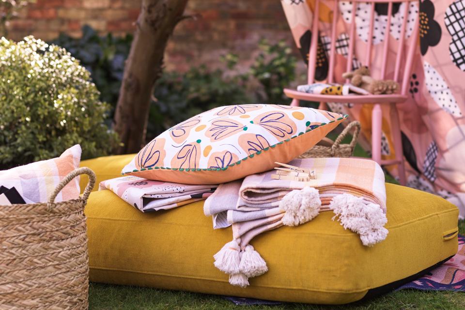 Outdoor cushions lying in a garden.
