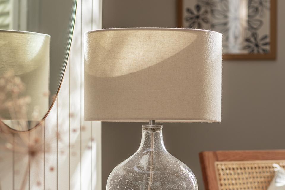 See through table lamp on sideboard.