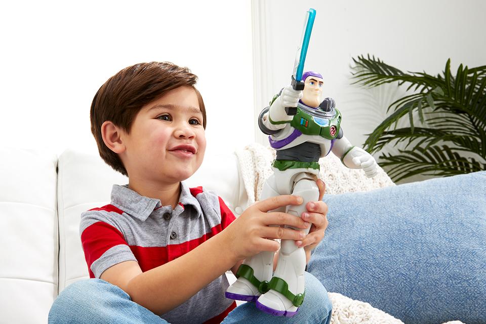  A young boy plays with the Disney Pixar’s Laser Blade Buzz Lightyear figure.