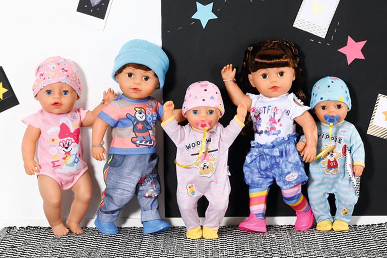 A set of BABY born dolls in colourful outfits.