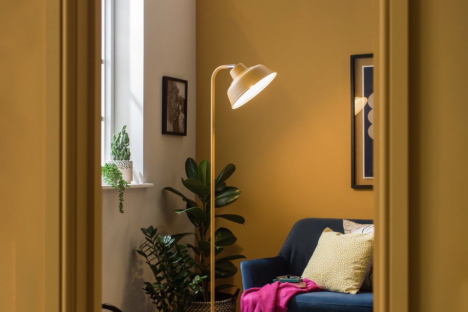Mustard living room with mustard lamp.