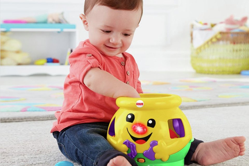 Toddler with shape sorting toy