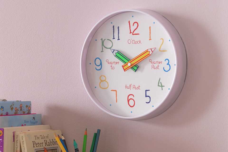 An Argos Home children's tell the time wall clock.