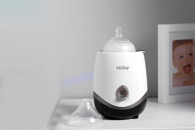An image of Nuby electric baby bottle and food warmer in black and white. 
