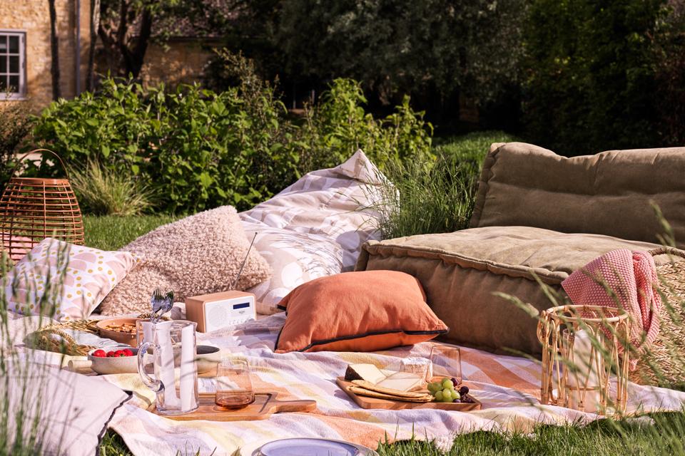 A cosy picnic setting in a home garden.