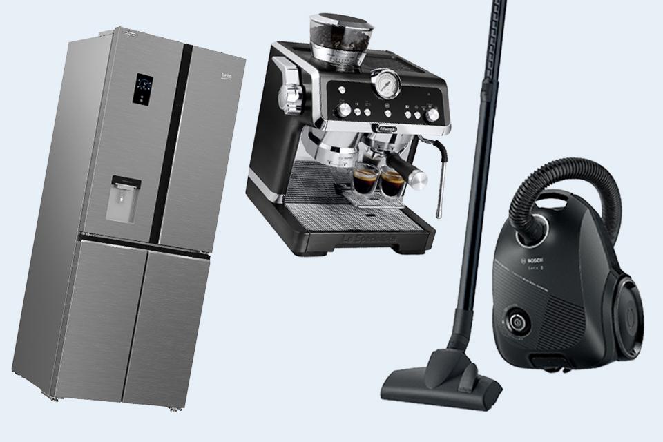 A silver american fridge freezer, a black and silver coffee machine and a black cylinder vacuum.