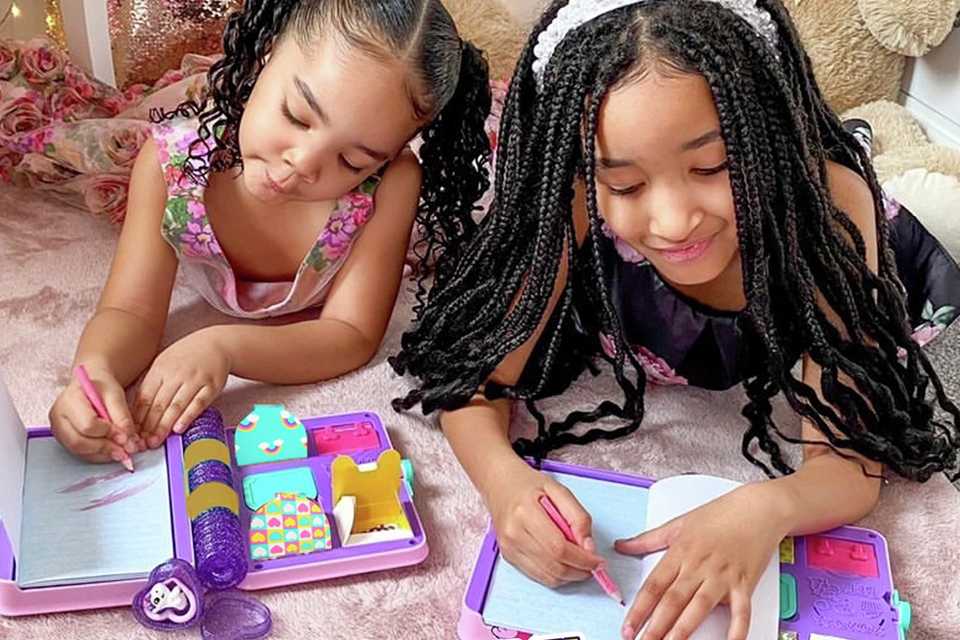 Two girls using their FunLockets secret journal diary set.