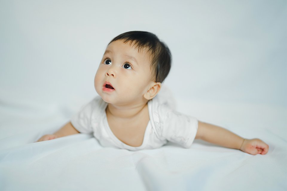A curious baby looking up.