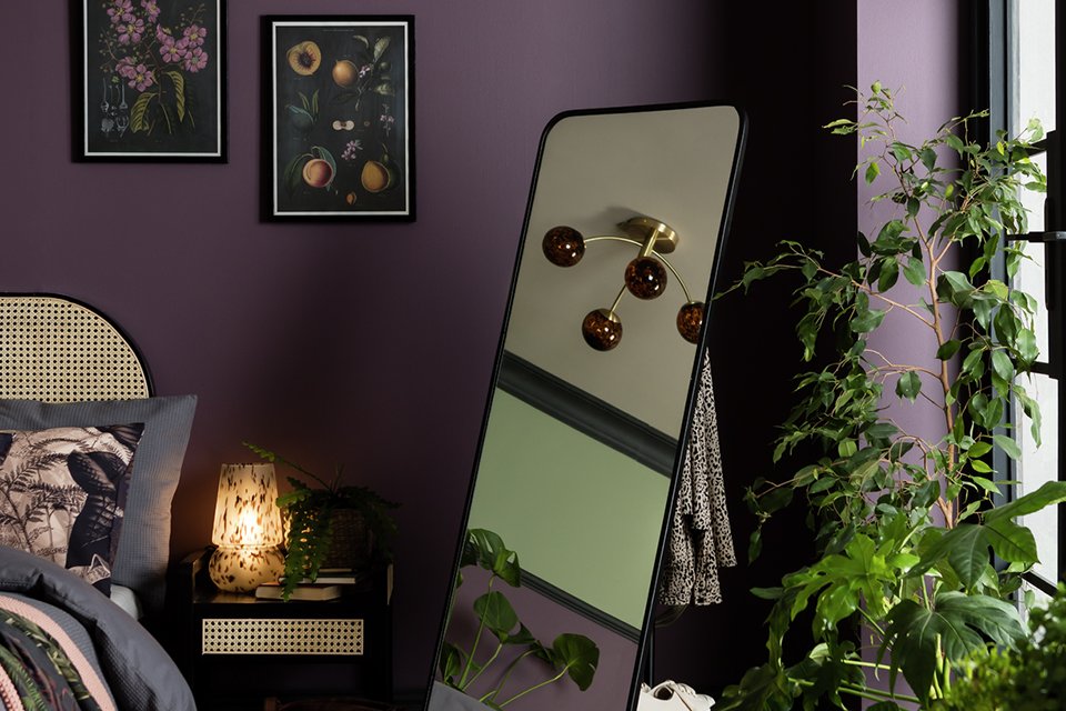 Free standing black edge curve mirror.