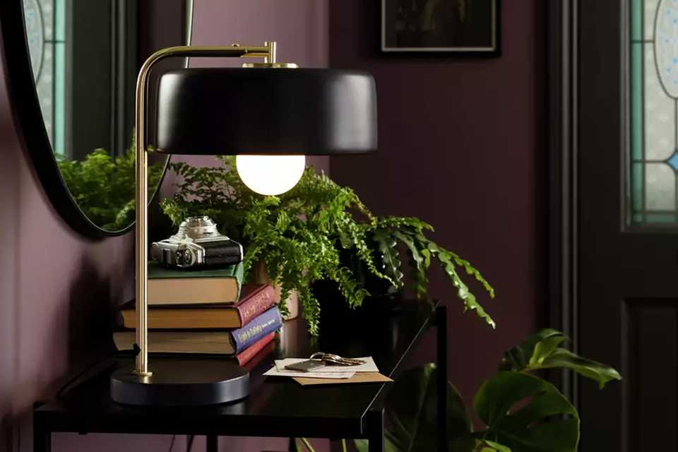 A Habitat table lamp in black and brass.