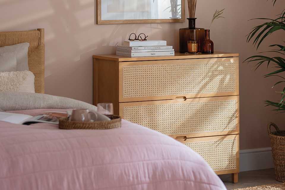 A Habitat 3 drawer chest in birch effect in a bedroom. 