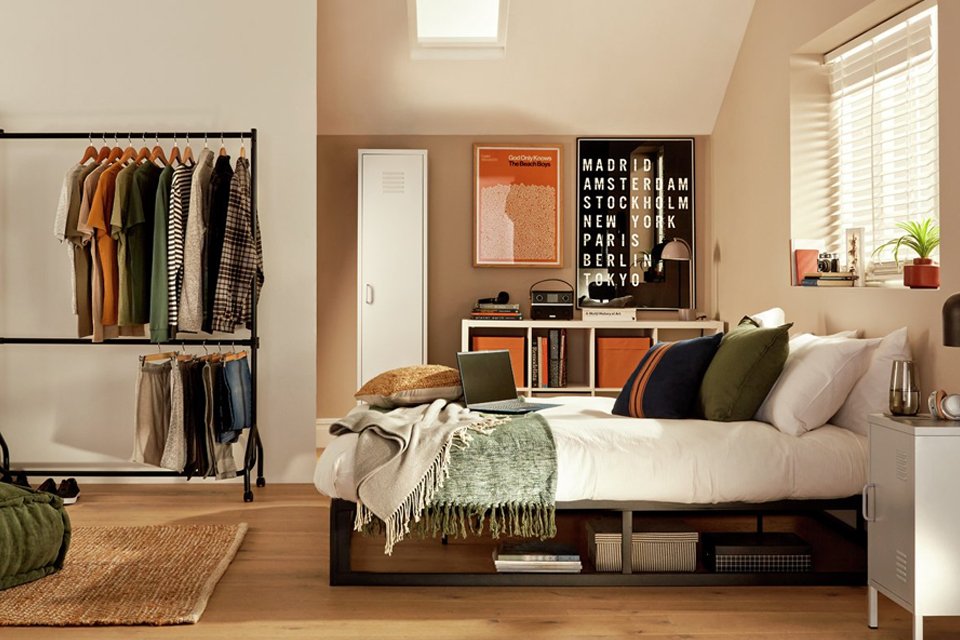 An Argos Home heavy duty 2-tier wheeled clothes rail.