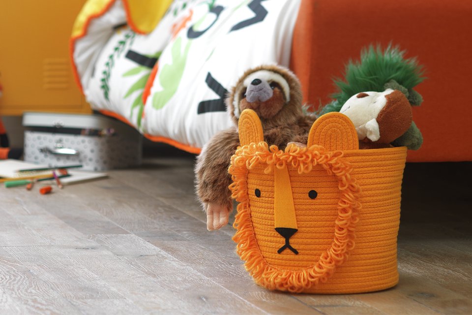 Soft toys in a Habitat lion rope kids storage basket.