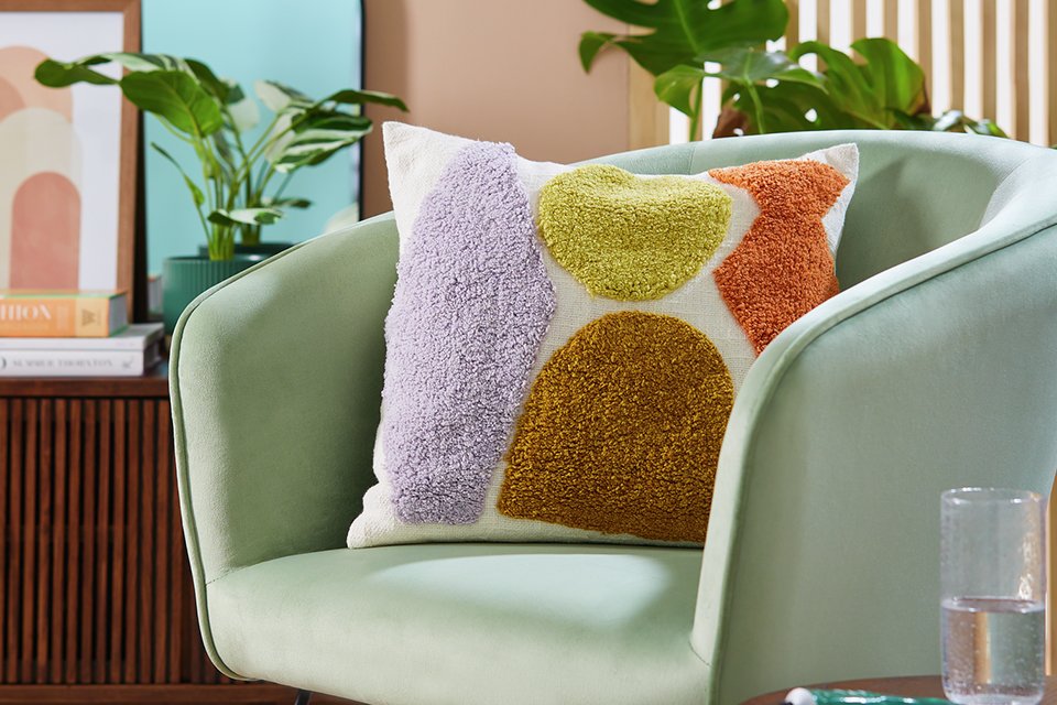 Cushion on blue chair.