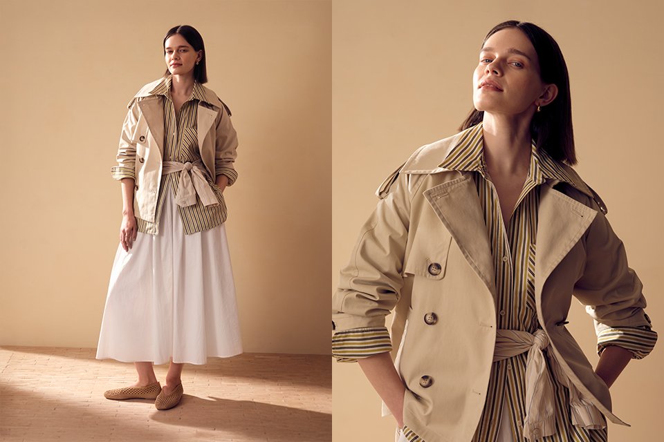 Lightweight neutral trench jacket styled with striped shirt and white midi skirt for spring layering.