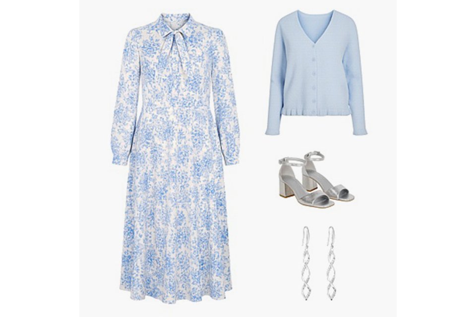Blue and white floral long sleeve midi dress styled with a light blue cardigan, silver block‑heel sandals and drop earrings on a white background.