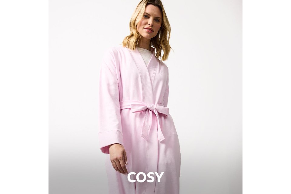 Soft grey women’s cosy loungewear set with tie‑waist top and relaxed trousers.