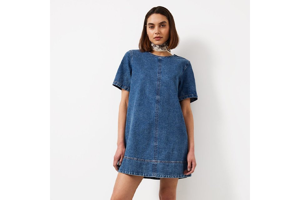 Short sleeve denim mini dress with a relaxed fit, styled for everyday spring and summer wear.