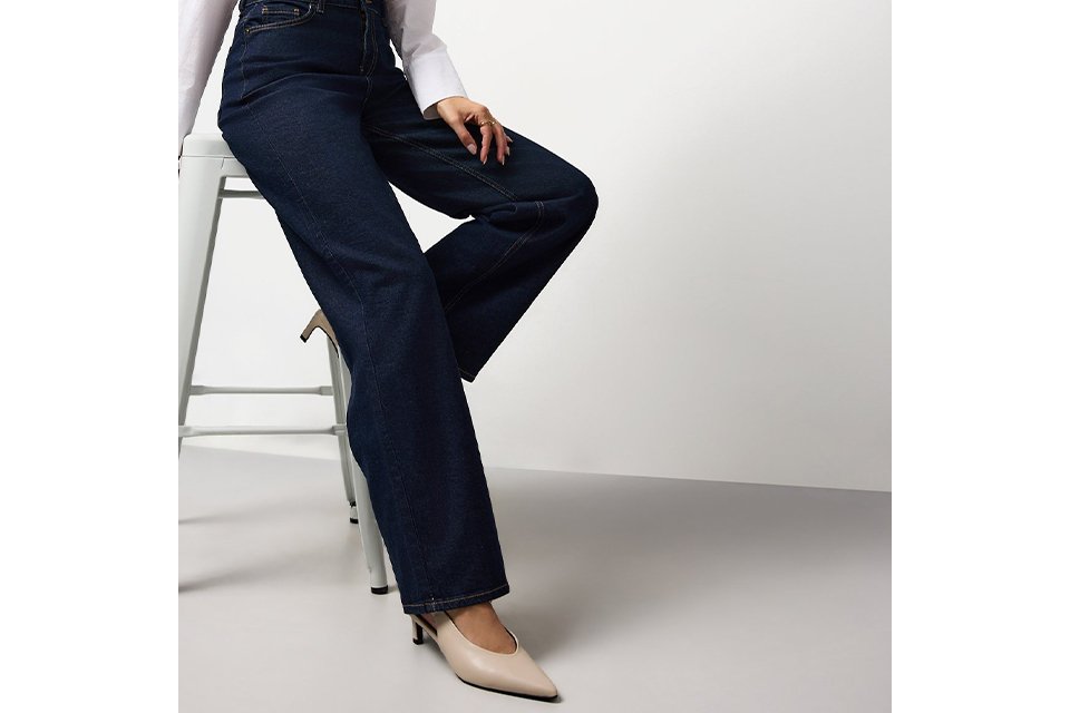 Tailored women’s jeans with a flattering straight-leg fit, styled with heels to show denim shape and length.