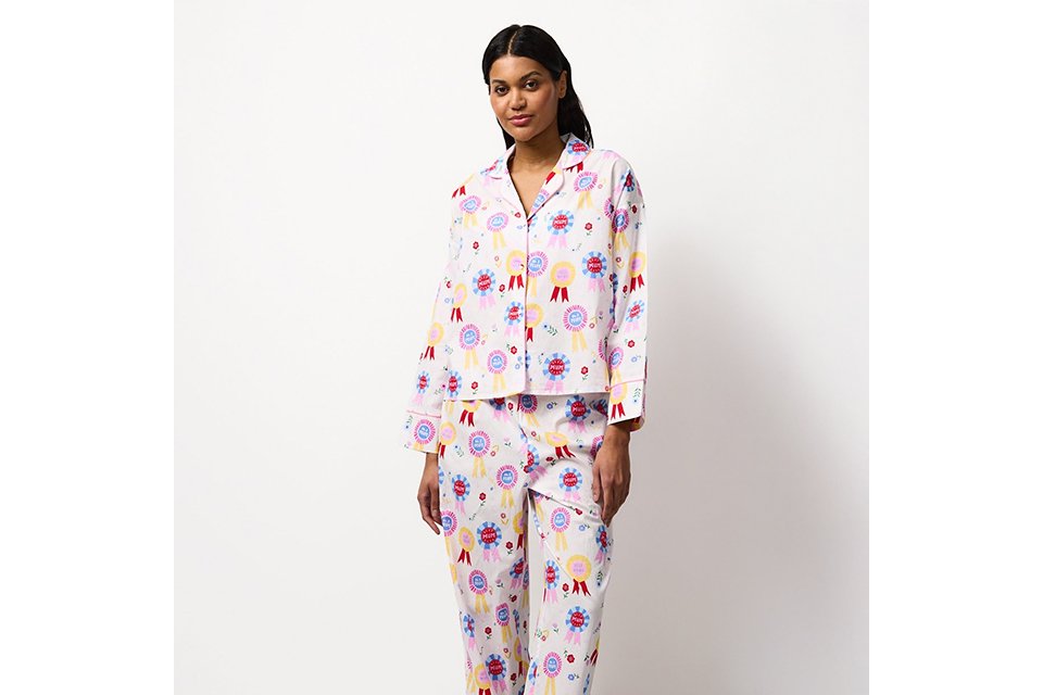 Printed pyjama set with long sleeve top and matching trousers, styled for comfortable women’s nightwear.