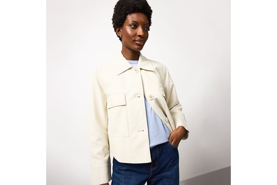 Light-coloured jacket styled with casual separates, reflecting trending spring outfits seen on social media.