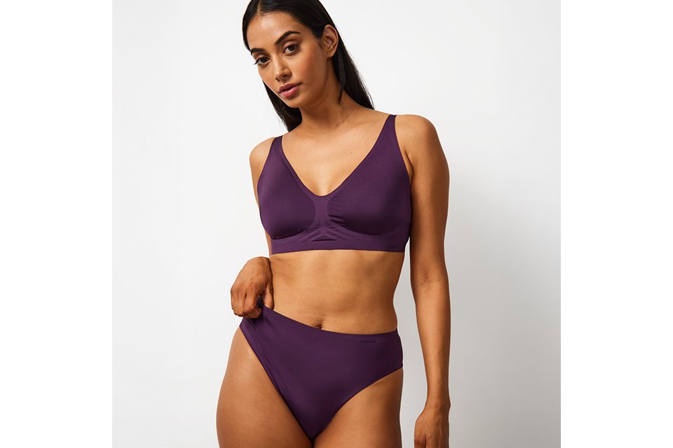 Purple lingerie set with a supportive bra and matching briefs, showcasing new‑in women’s lingerie styles.