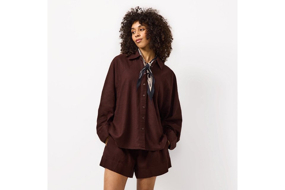 Lightweight linen co-ord featuring a relaxed shirt and shorts, styled for warm-weather dressing.