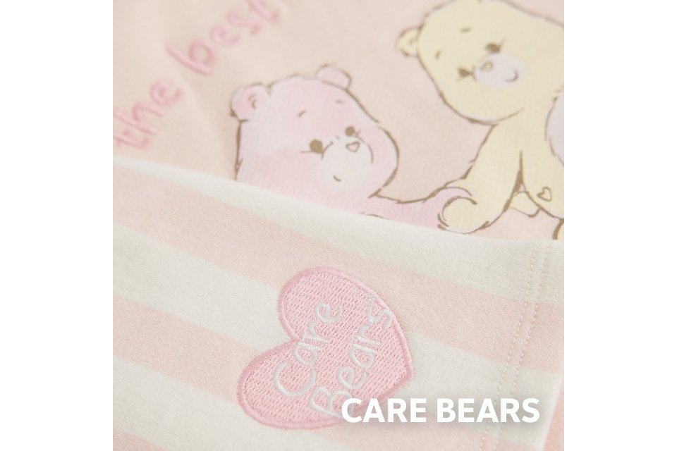 Care Bears baby sleepsuit print in soft cotton.