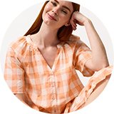 Woman modelling floral pyjamas from the women’s nightwear range.