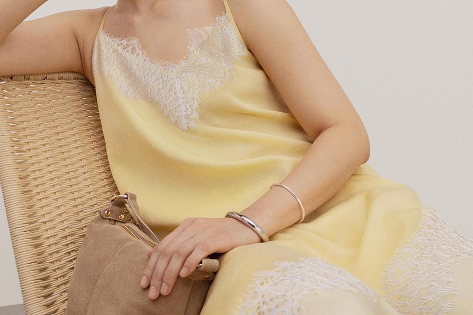 Seasonal summer outfit featuring a lightweight top and accessories, showcasing current warm‑weather fashion trends.